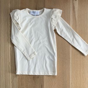 Cream long sleeve tee with shoulder detail.